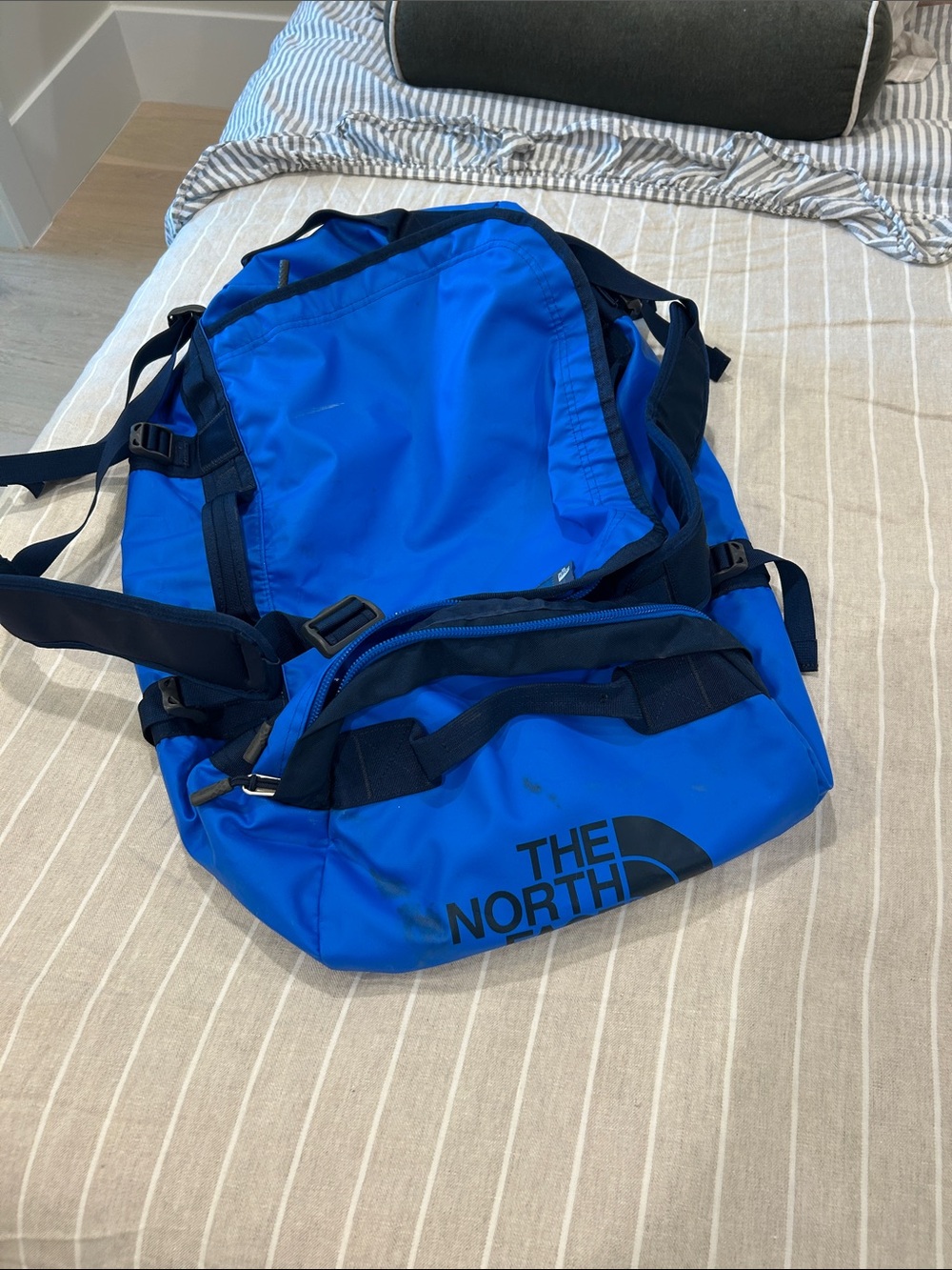 The North Face Blue Duffel Bag with Navy Logo and Straps